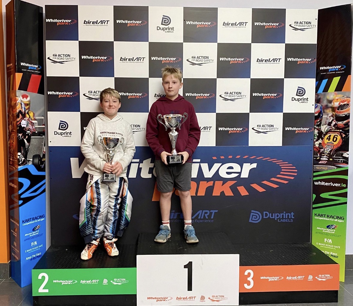 Danny Murphy holding a trophy on the Whiteriver podium